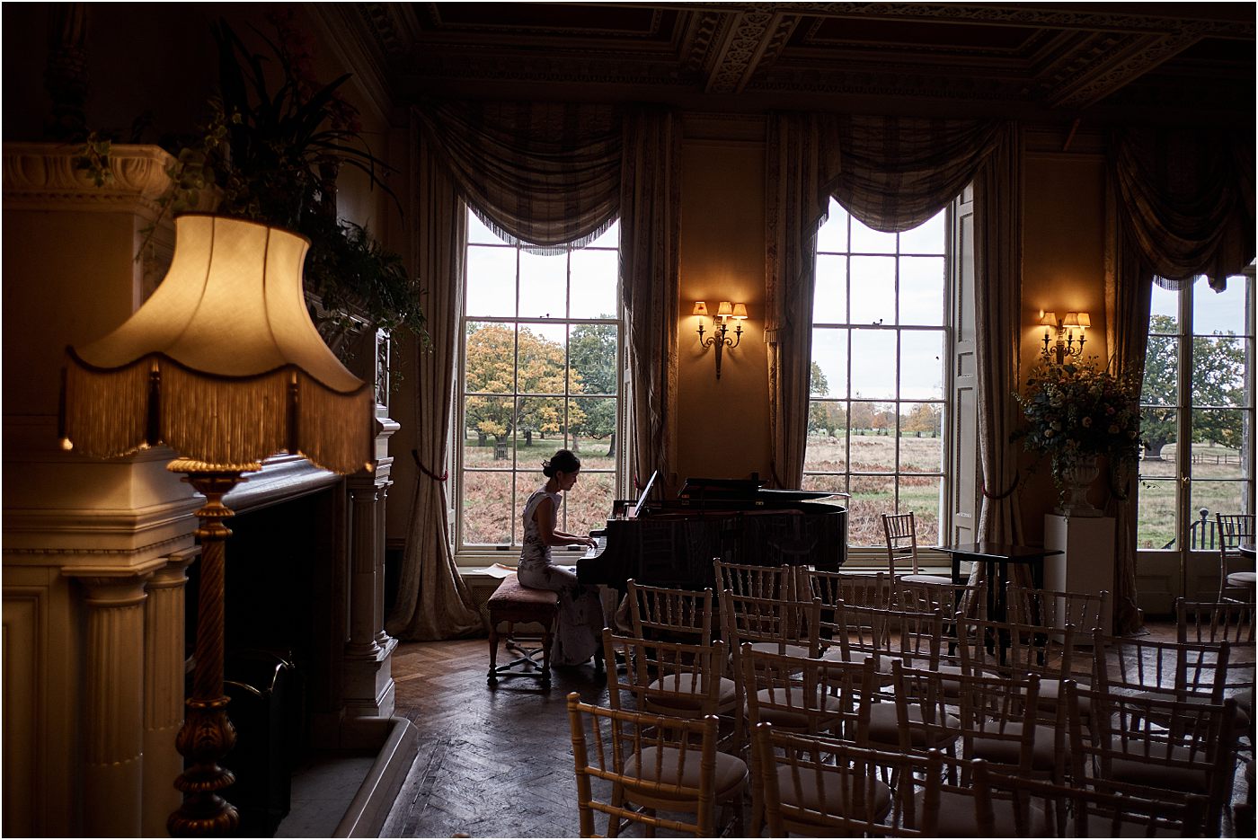 Playing the piano at Hampton Court House